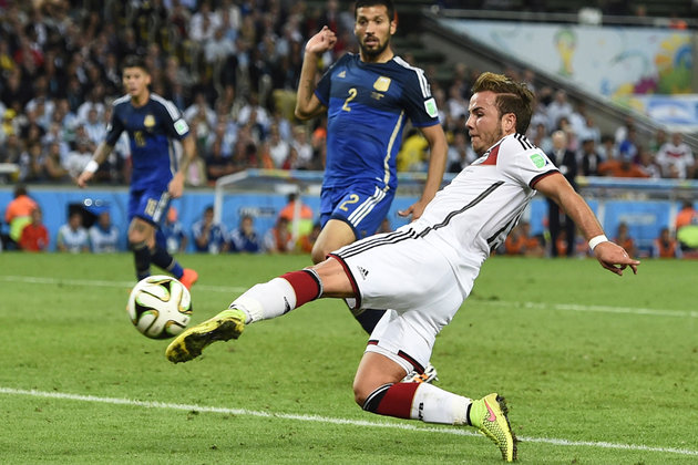 Germany's Goetze shoots to score a goal against Argentina during extra time in their 2014 World Cup final at the Maracana stadium in Rio de Janeiro